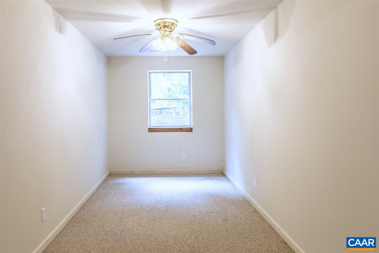 703 George James Loop Radiant, VA 22732 - Photo 31 of 48 an empty room with a window and a fan