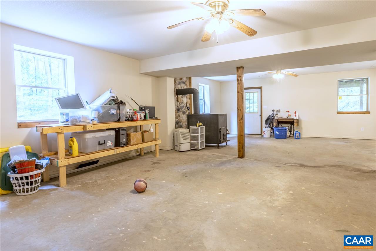 703 George James Loop Radiant, VA 22732 - Photo 35 of 48 a bedroom with furniture and a chandelier