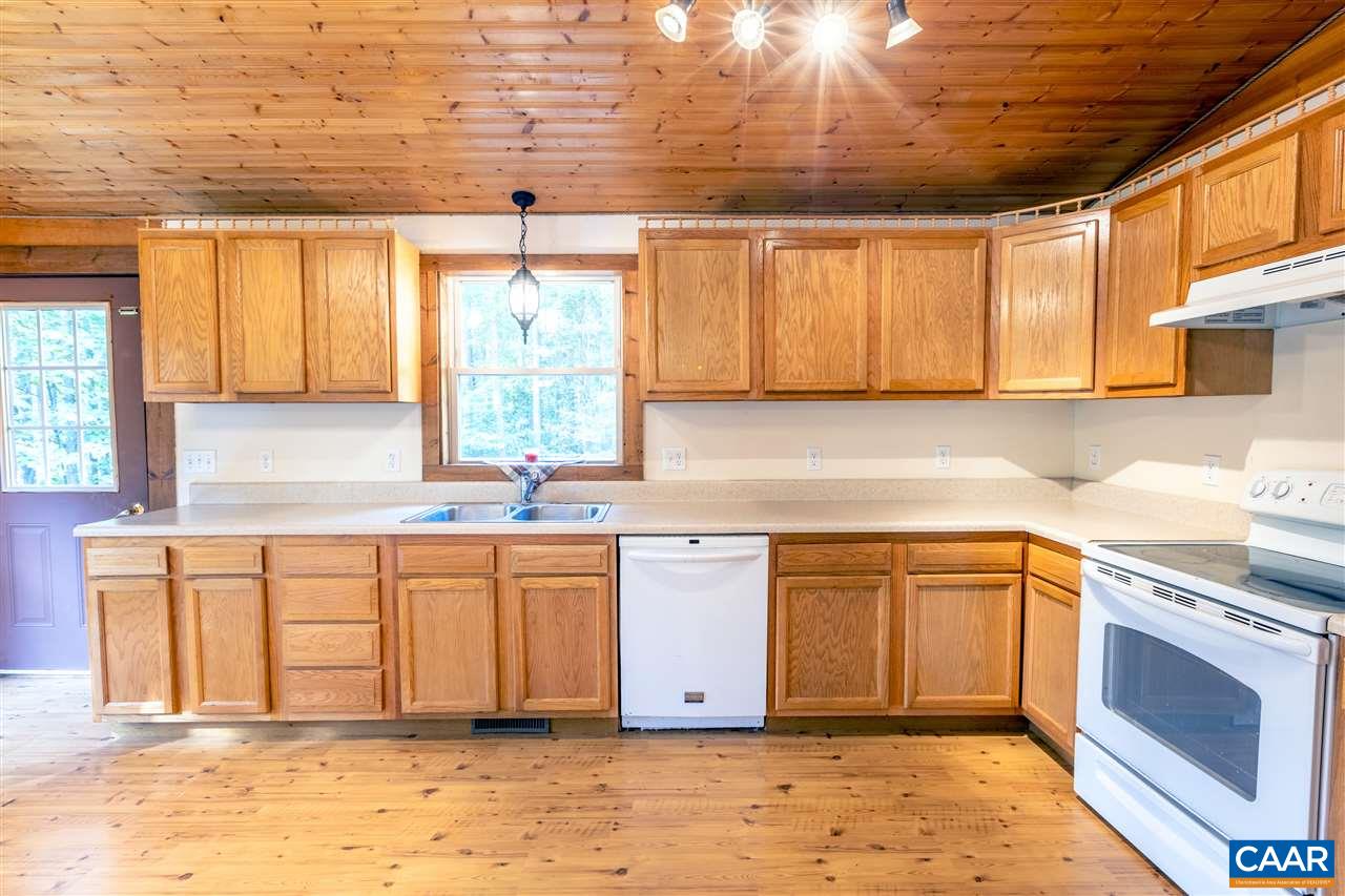 703 George James Loop Radiant, VA 22732 - Photo 7 of 48 a kitchen with stainless steel appliances granite countertop a stove a sink and a microwave