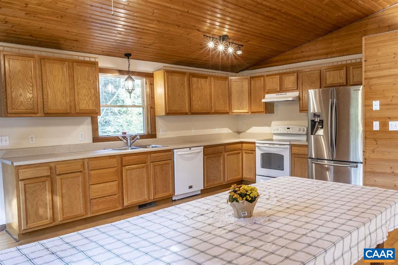703 George James Loop Radiant, VA 22732 - Photo 8 of 48 a kitchen with granite countertop a sink stainless steel appliances and cabinets