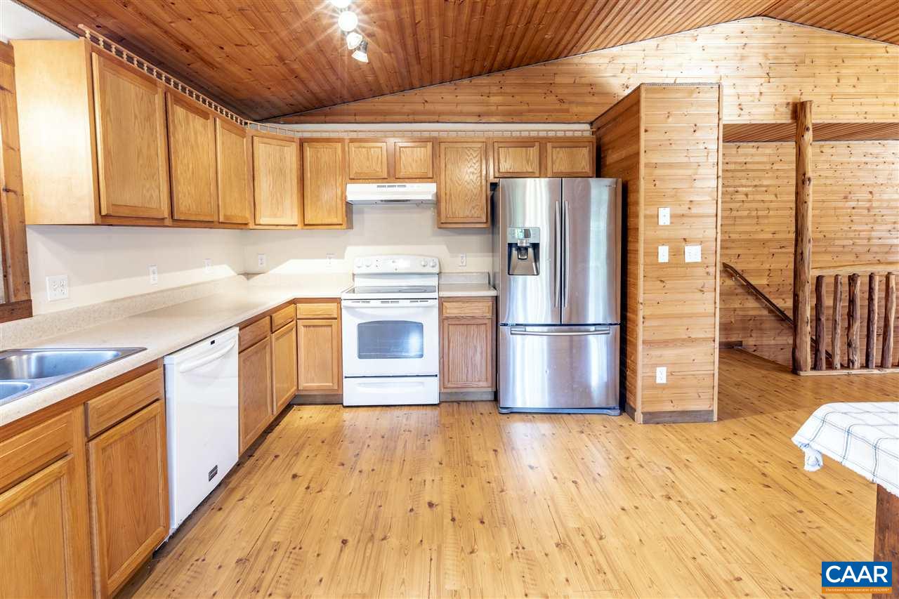 703 George James Loop Radiant, VA 22732 - Photo 9 of 48 a kitchen with stainless steel appliances granite countertop a refrigerator a sink and a stove