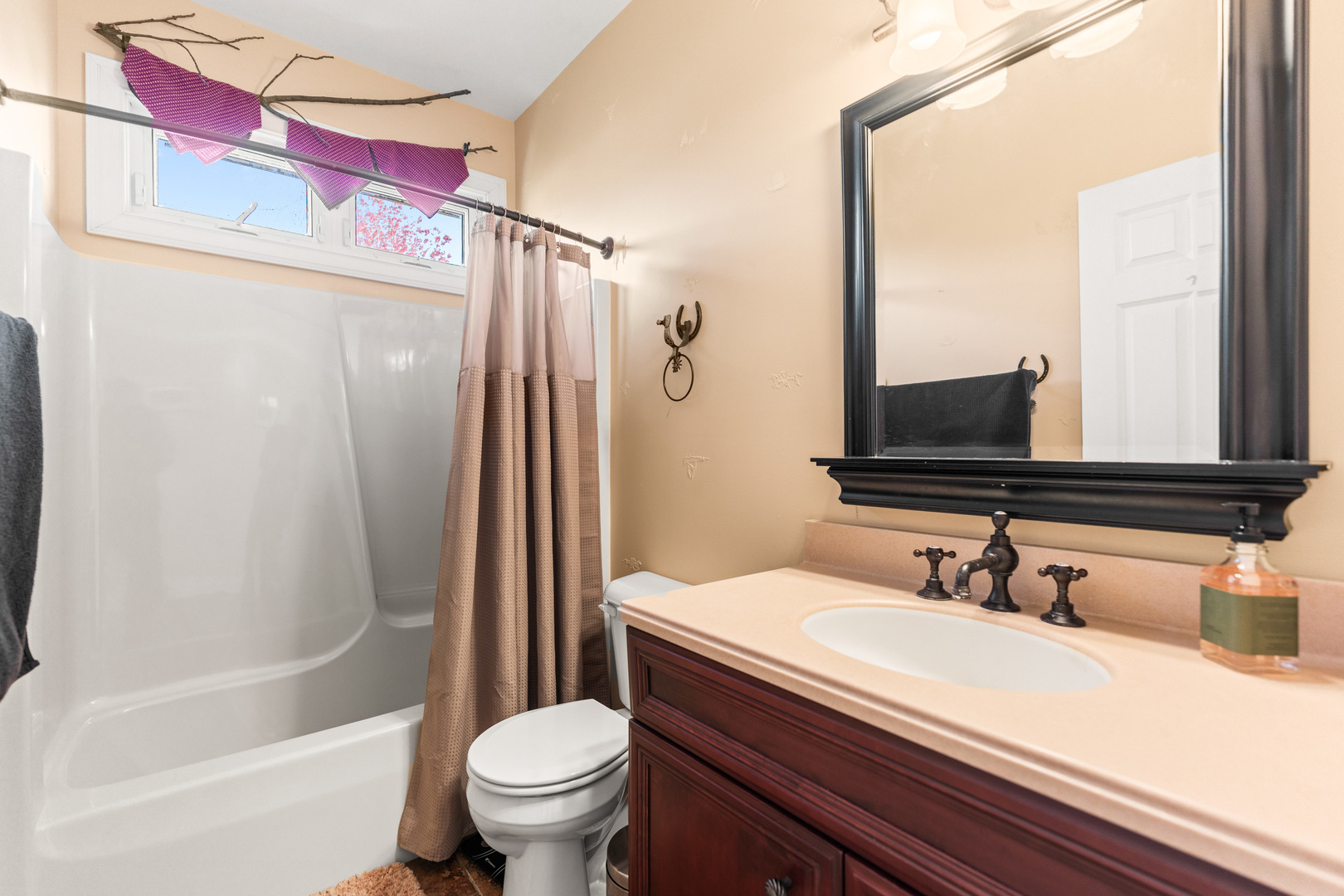 2601 North 3653rd Road Sheridan, IL 60551 - Photo 26 of 85 a bathroom with a sink a toilet a mirror and shower