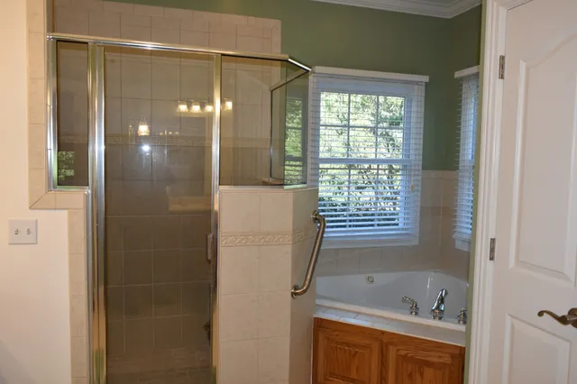 a living room with furniture and a mirror