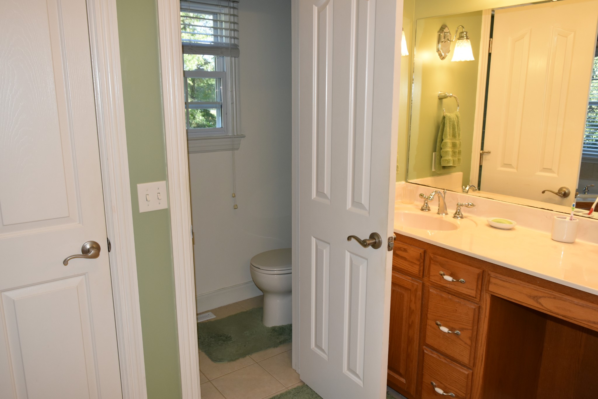 2828 Bains Road Hillsboro, TN 37342 - Photo 12 of 69 a bathroom with a granite countertop sink toilet and shower