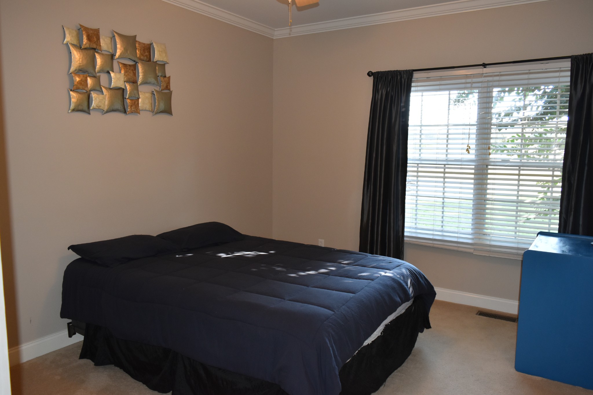 2828 Bains Road Hillsboro, TN 37342 - Photo 19 of 69 a bed sitting in a bedroom next to a window