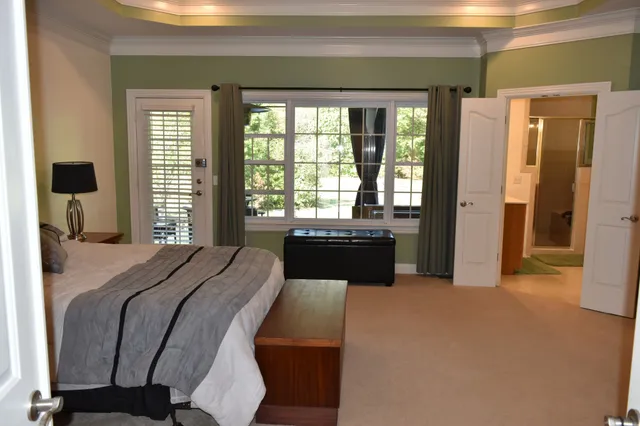 a kitchen with kitchen island granite countertop a refrigerator and a stove