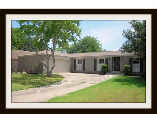 a view of a yard in front view of a house