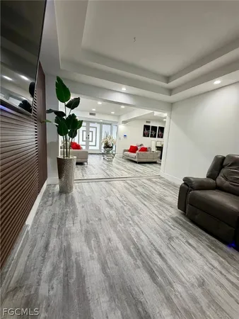 a bed room with a bed and with a large mirror