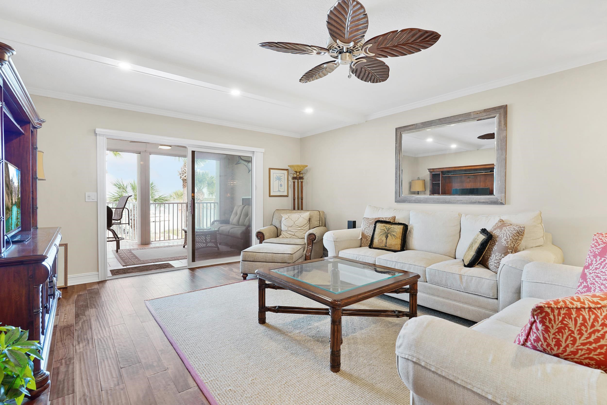 33 Comares Avenue, Unit 203 St. Augustine, FL 32080 - Photo 15 of 39 Living area featuring hardwood / wood-style flooring, ornamental molding, ceiling fan, and recessed lighting