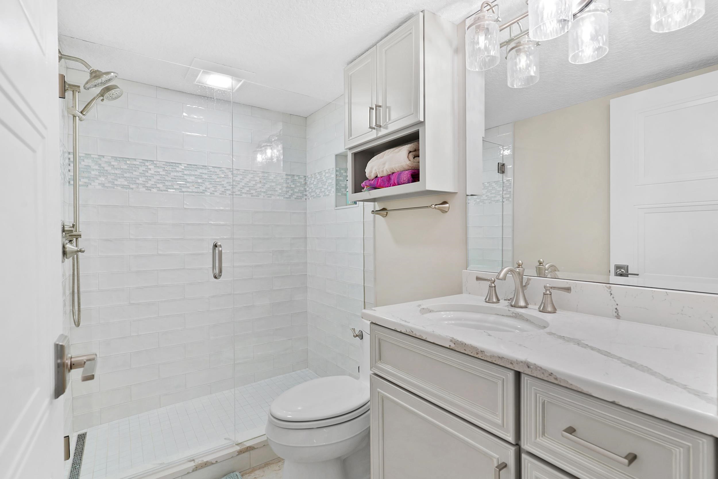 33 Comares Avenue, Unit 203 St. Augustine, FL 32080 - Photo 22 of 39 Full bath with vanity and a shower stall