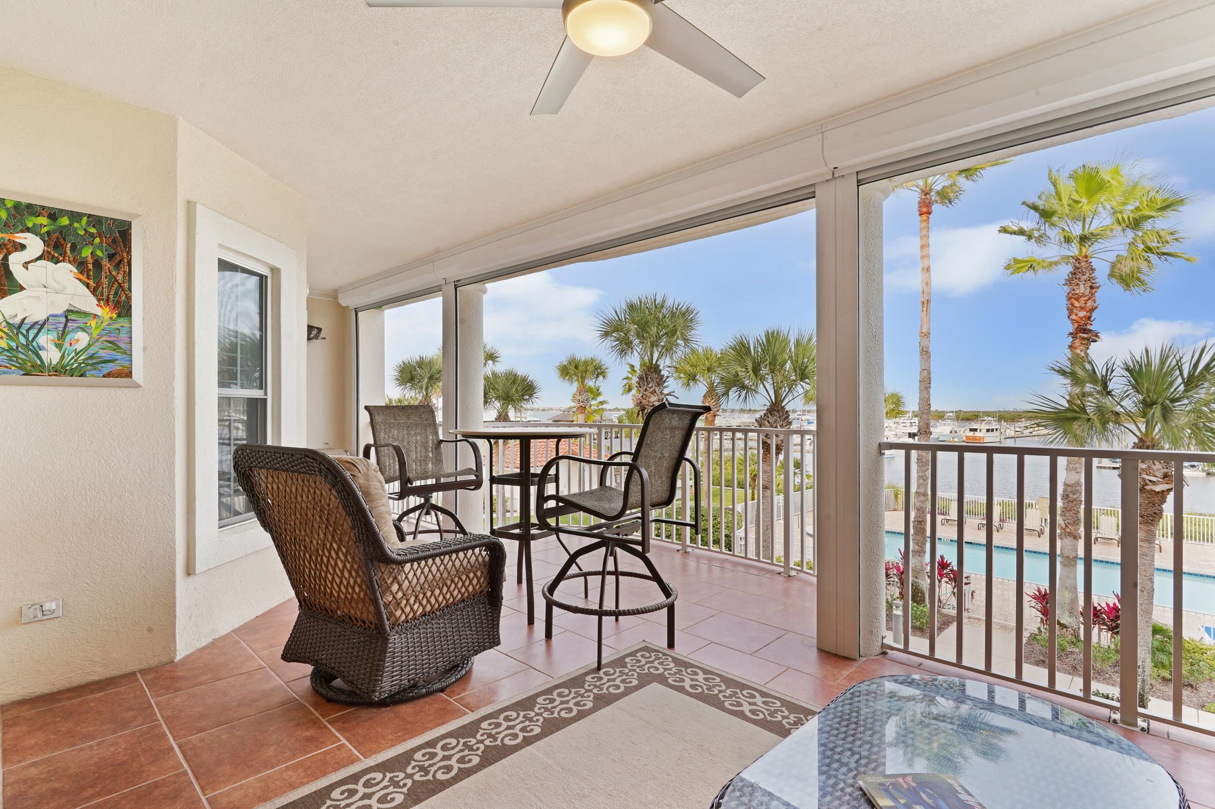 33 Comares Avenue, Unit 203 St. Augustine, FL 32080 - Photo 27 of 39 Sunroom featuring tile patterned floors and a textured wall