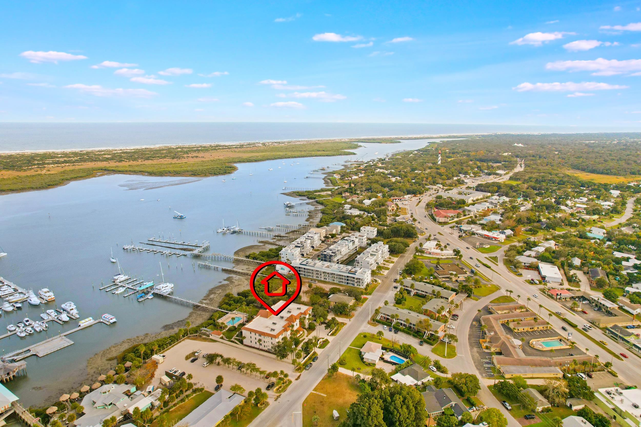 33 Comares Avenue, Unit 203 St. Augustine, FL 32080 - Photo 3 of 39 Aerial view of property and surrounding area with a large body of water and a marina