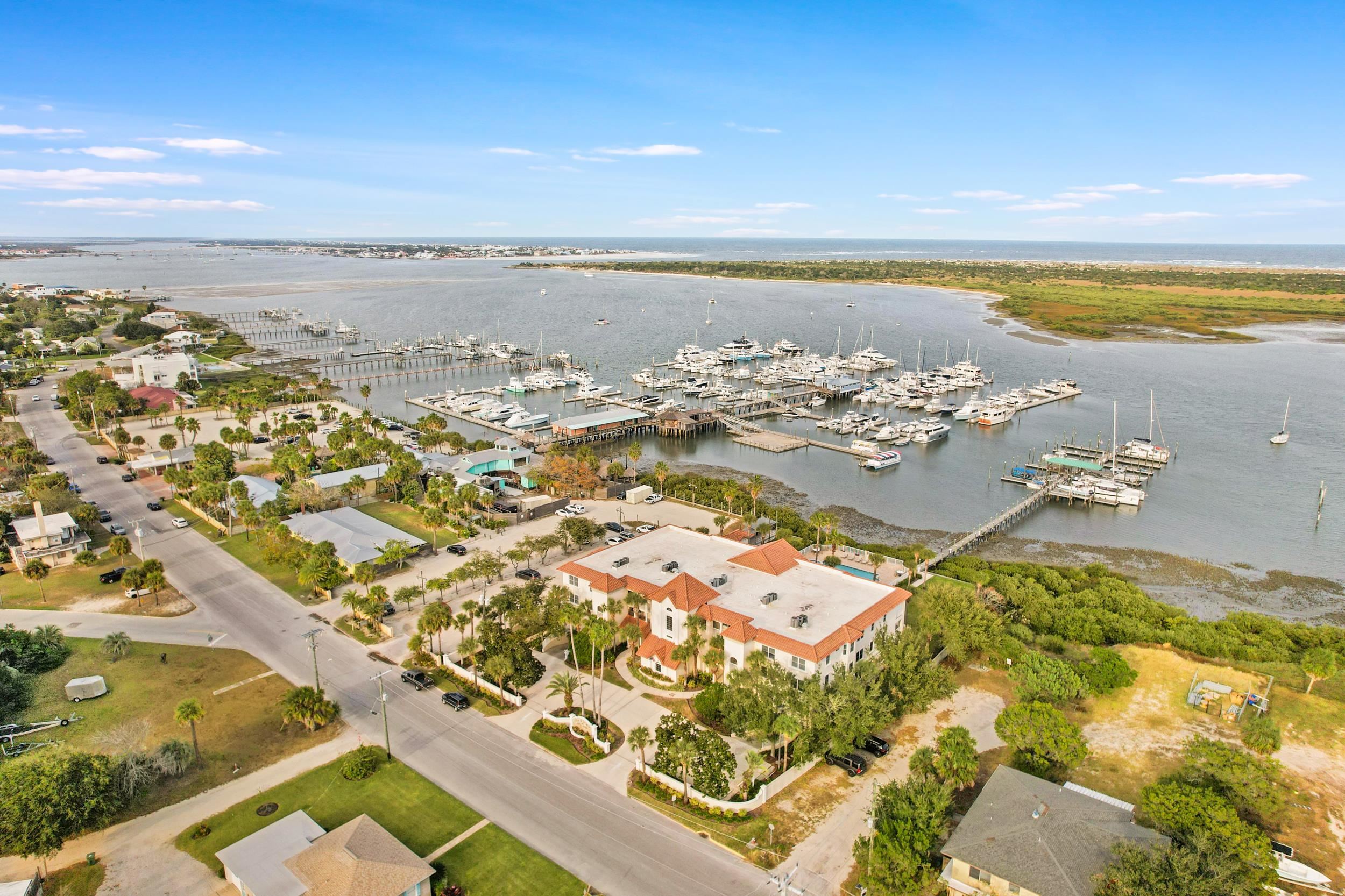 33 Comares Avenue, Unit 203 St. Augustine, FL 32080 - Photo 32 of 39 Aerial view of property's location featuring numerous boat docks and a nearby body of water