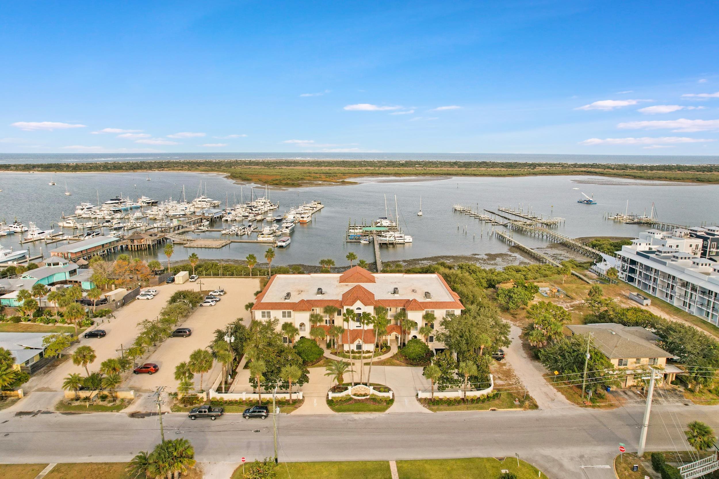 33 Comares Avenue, Unit 203 St. Augustine, FL 32080 - Photo 4 of 39 Drone / aerial view of numerous boat docks and a large body of water