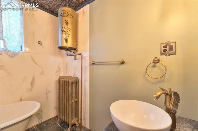 a bathroom with a sink mirror vanity and toilet