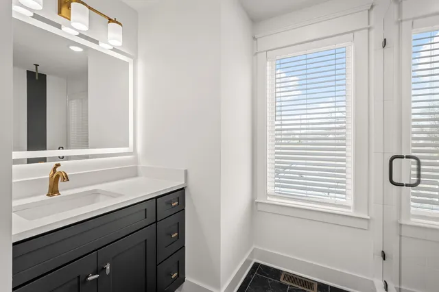 a bathroom with a sink and a mirror