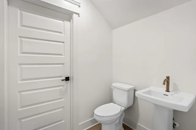 a bathroom with a toilet and a sink