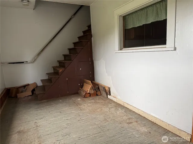 a kitchen with cabinets appliances and a counter space