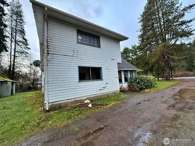 a house with a tree in front of it