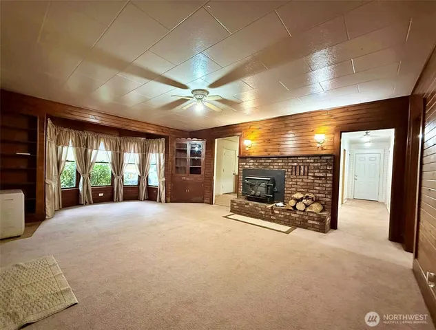 a view of an empty room with windows