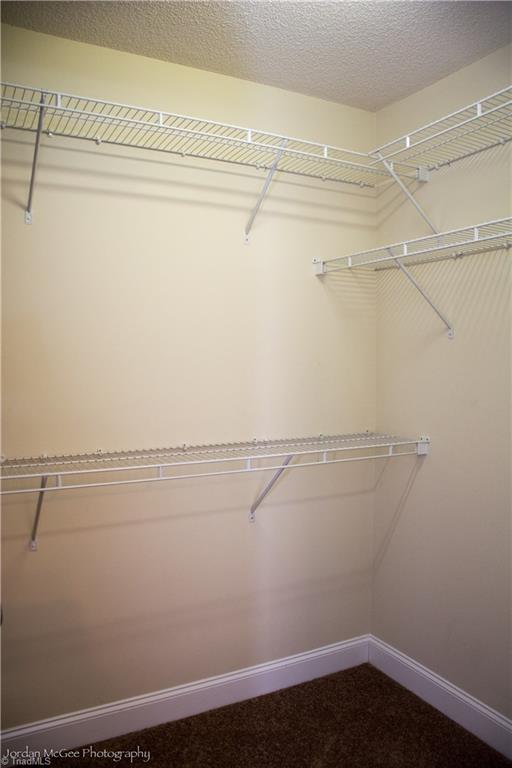 879 Ridge View Terrace Rural Hall, NC 27045 - Photo 11 of 18 Walk-in closet in master bedroom.