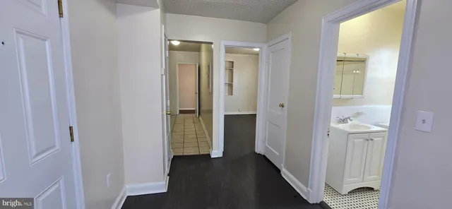 a view of a bathroom from the hallway
