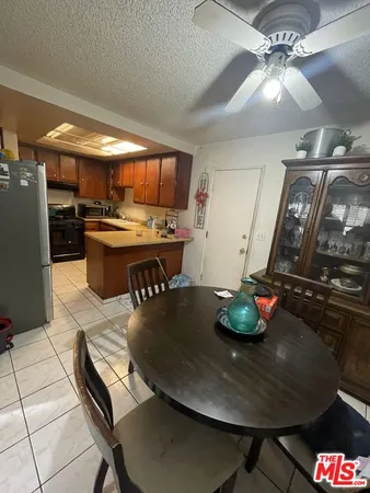 a dining room with a table and chairs