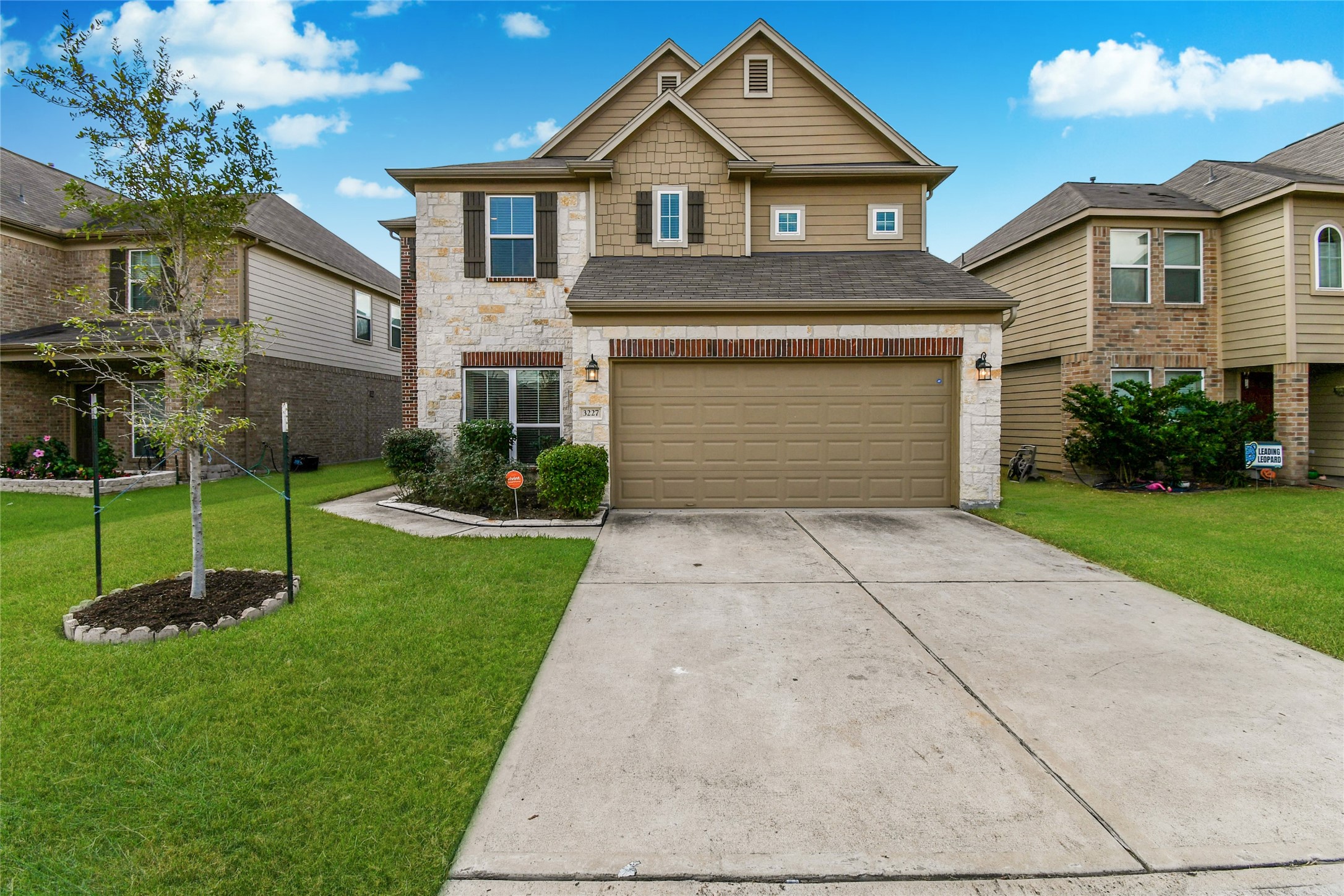 3227 Thicket Path Way Katy, TX 77493 - Photo 1 of 40 a front view of a house with a garden and plants