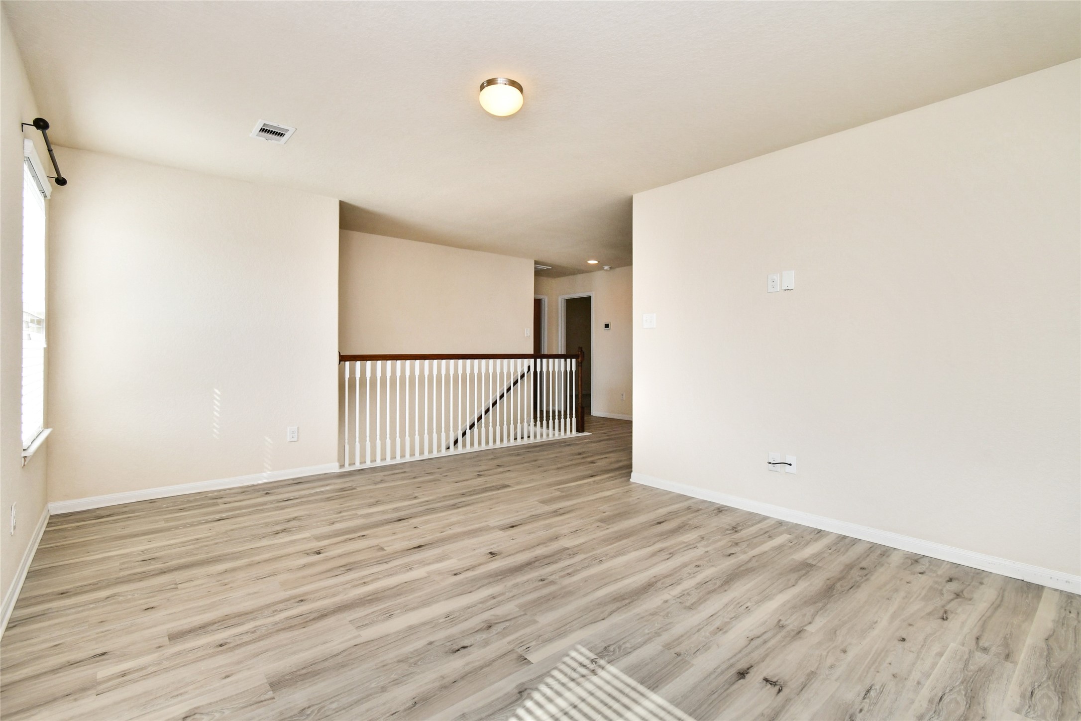 3227 Thicket Path Way Katy, TX 77493 - Photo 16 of 40 a view of empty room with wooden floor