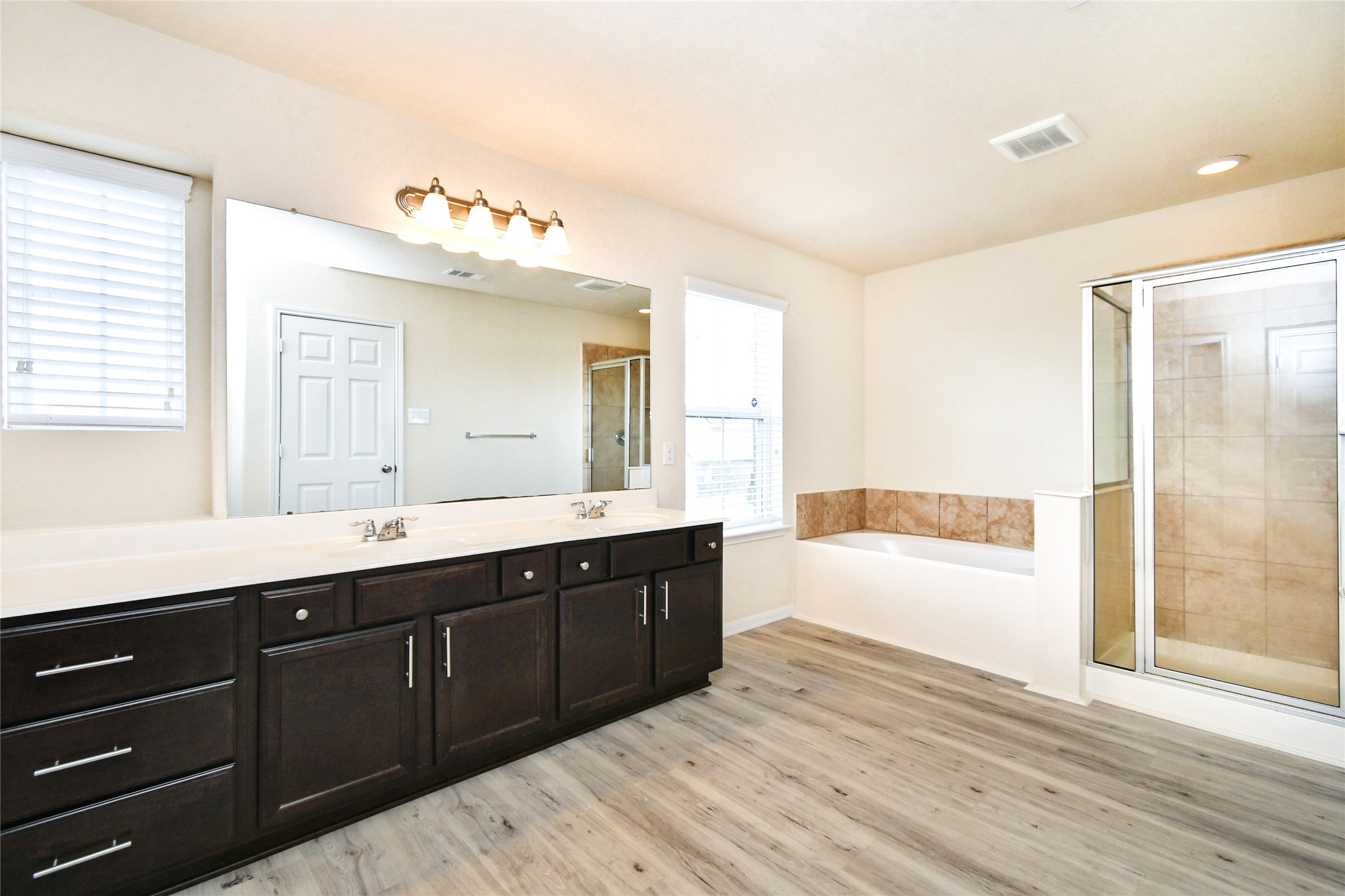 3227 Thicket Path Way Katy, TX 77493 - Photo 20 of 40 a spacious bathroom with a tub sink and mirror