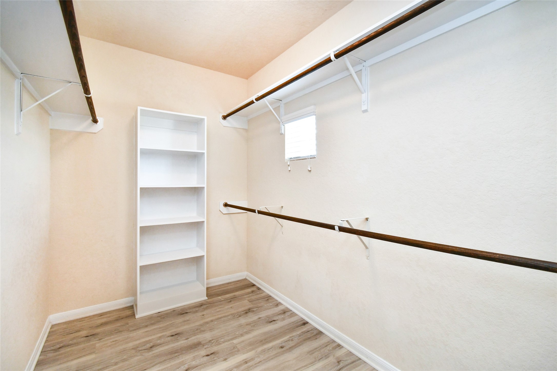 3227 Thicket Path Way Katy, TX 77493 - Photo 23 of 40 a view of walk in closet with empty racks