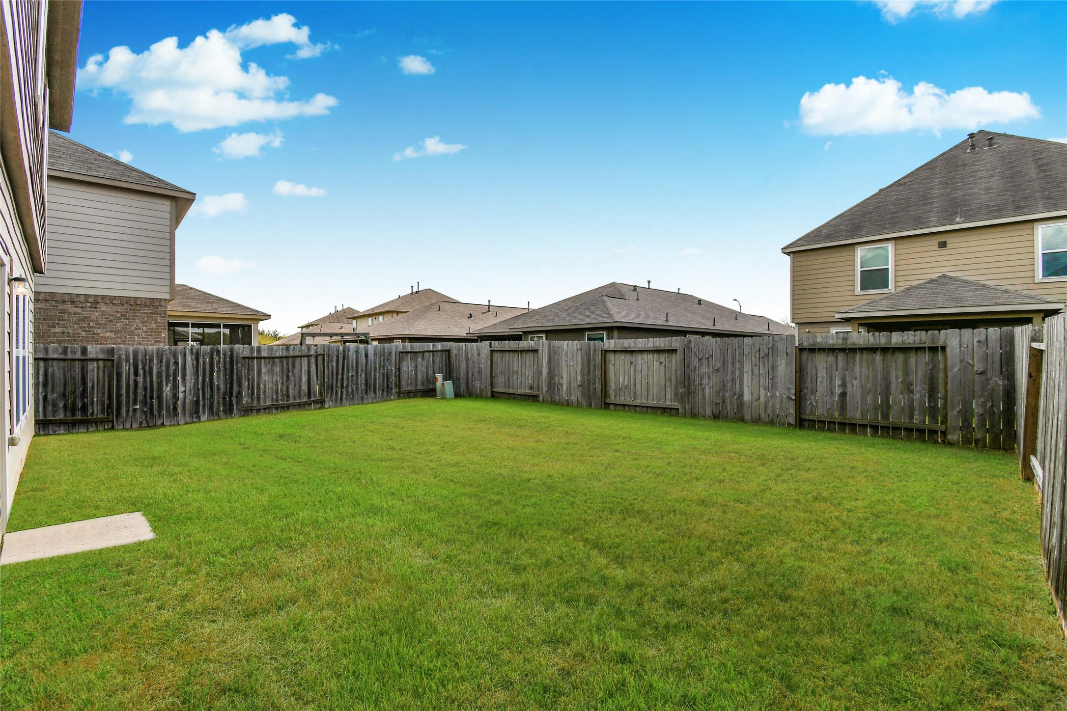 3227 Thicket Path Way Katy, TX 77493 - Photo 38 of 40 a view of a backyard with table and chairs and wooden fence