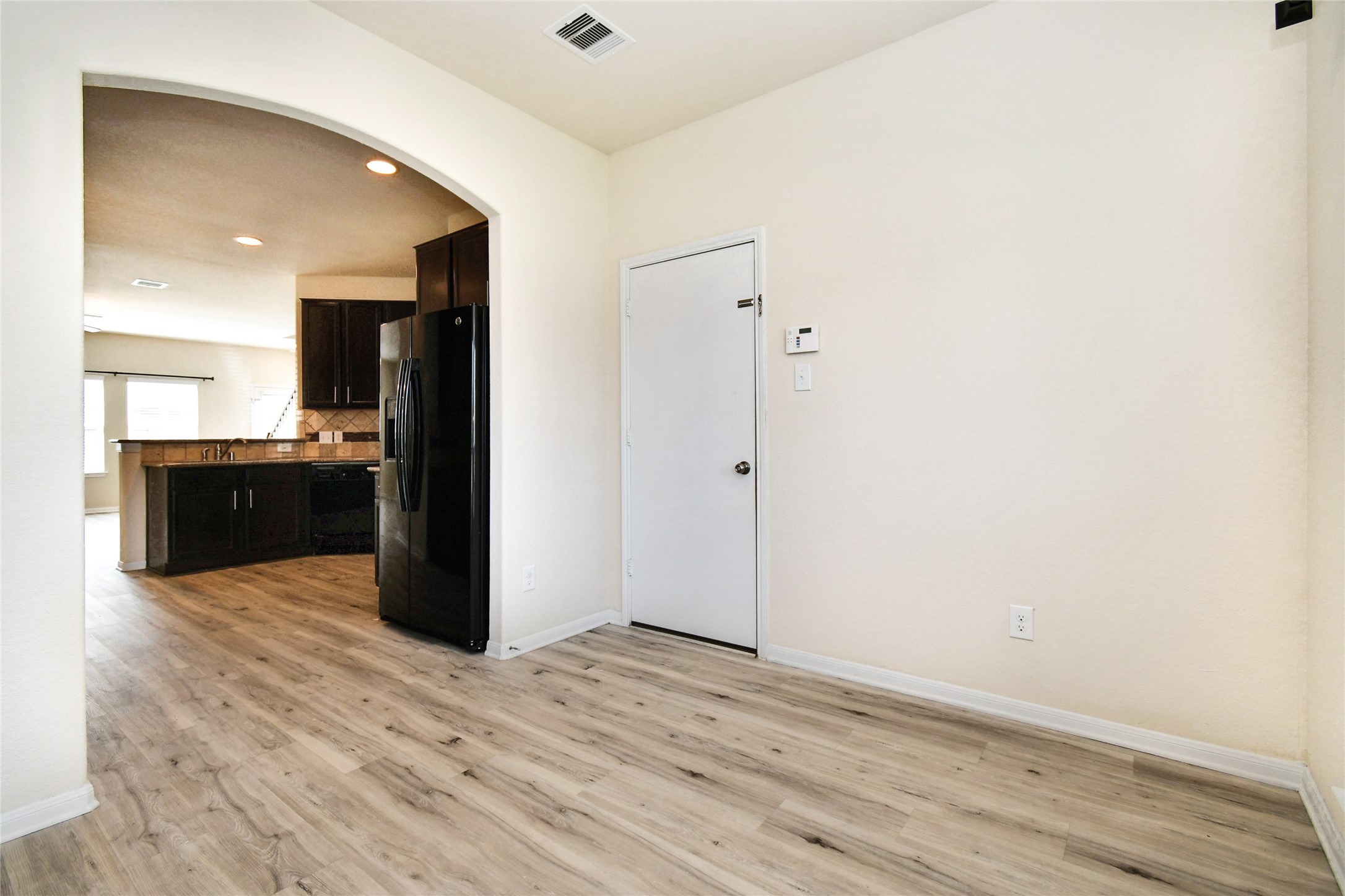 3227 Thicket Path Way Katy, TX 77493 - Photo 9 of 40 a view of kitchen with refrigerator and wooden floor