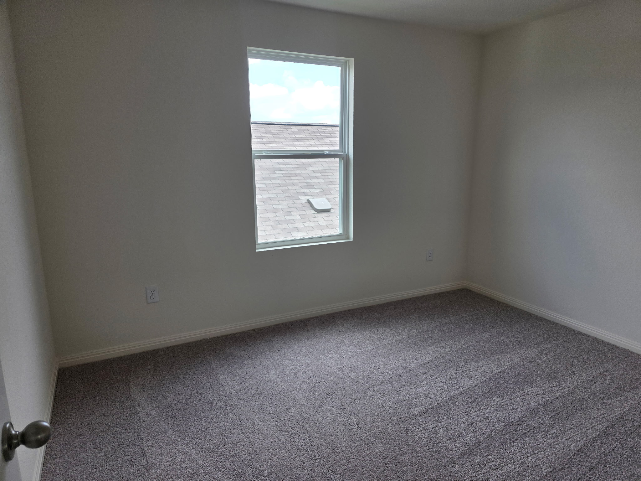 353 Enforcer Loop Jarrell, TX 76537 - Photo 16 of 21 Carpeted spare room featuring baseboards
