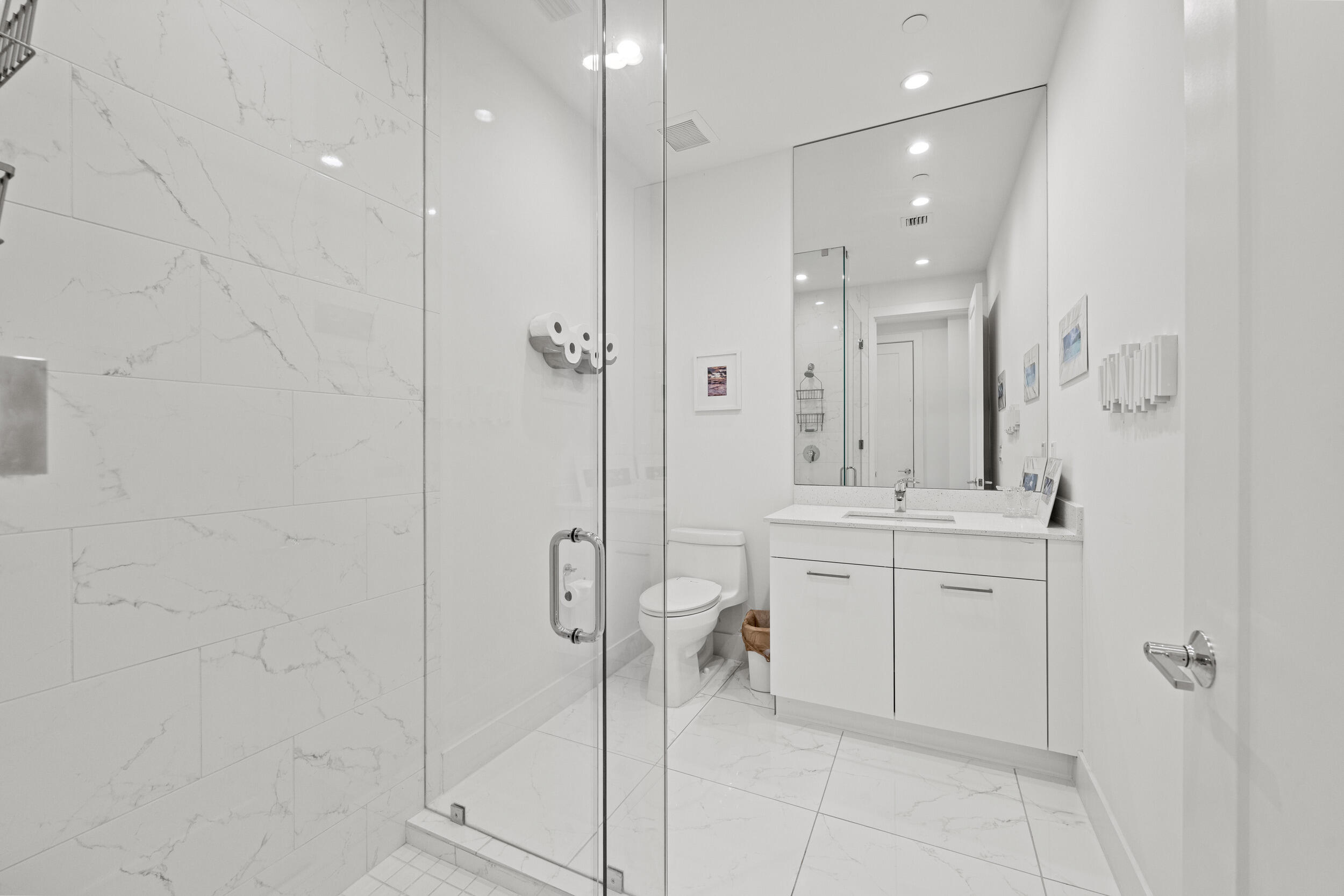 1811 Northwest 42nd Drive Boca Raton, FL 33431 - Photo 23 of 51 a bathroom with a granite countertop sink a toilet and shower