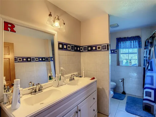 a bedroom with furniture and a bed