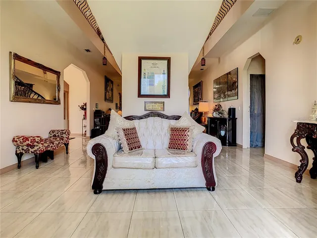 a living room with furniture and a couch