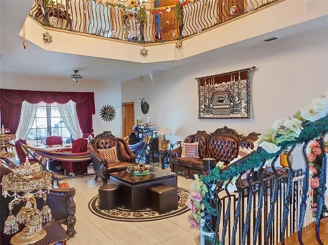 a kitchen with a sink a stove and chairs