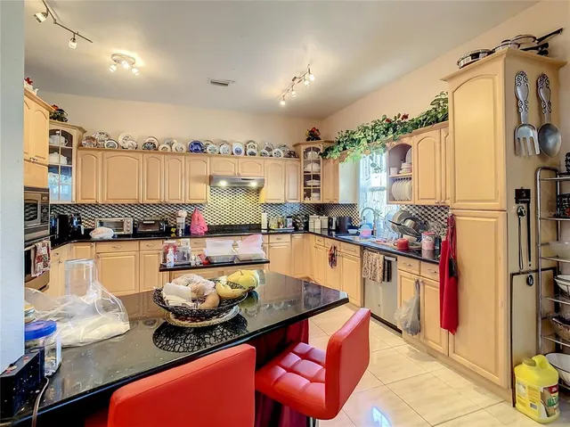 a bedroom with bed and a couch