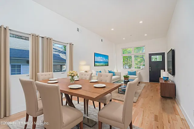 a view of a dining room with furniture and window