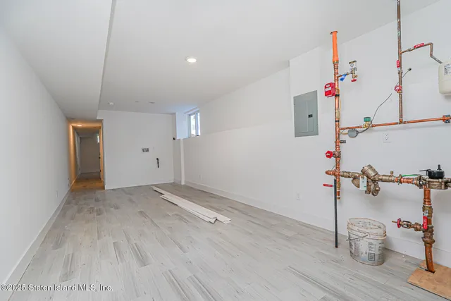 a view of a storage & utility room with empty racks