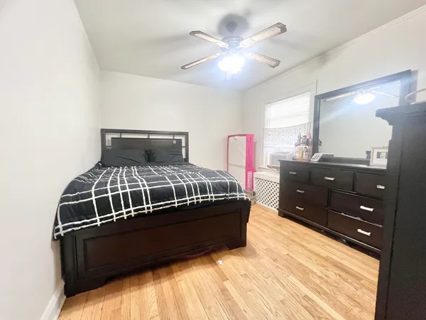 a bedroom with a bed and a mirror