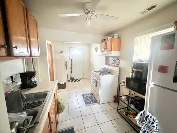 a room with furniture a flat screen tv and a window