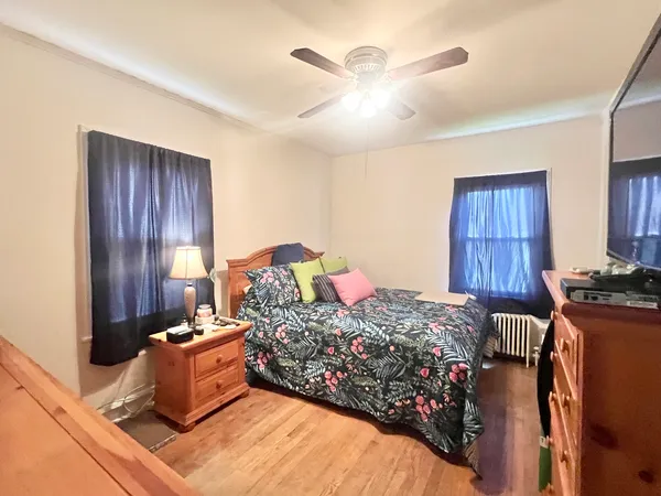 a bed room with a bed and a dresser