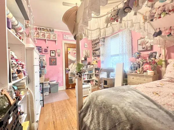a bed room with a bed and a chandelier