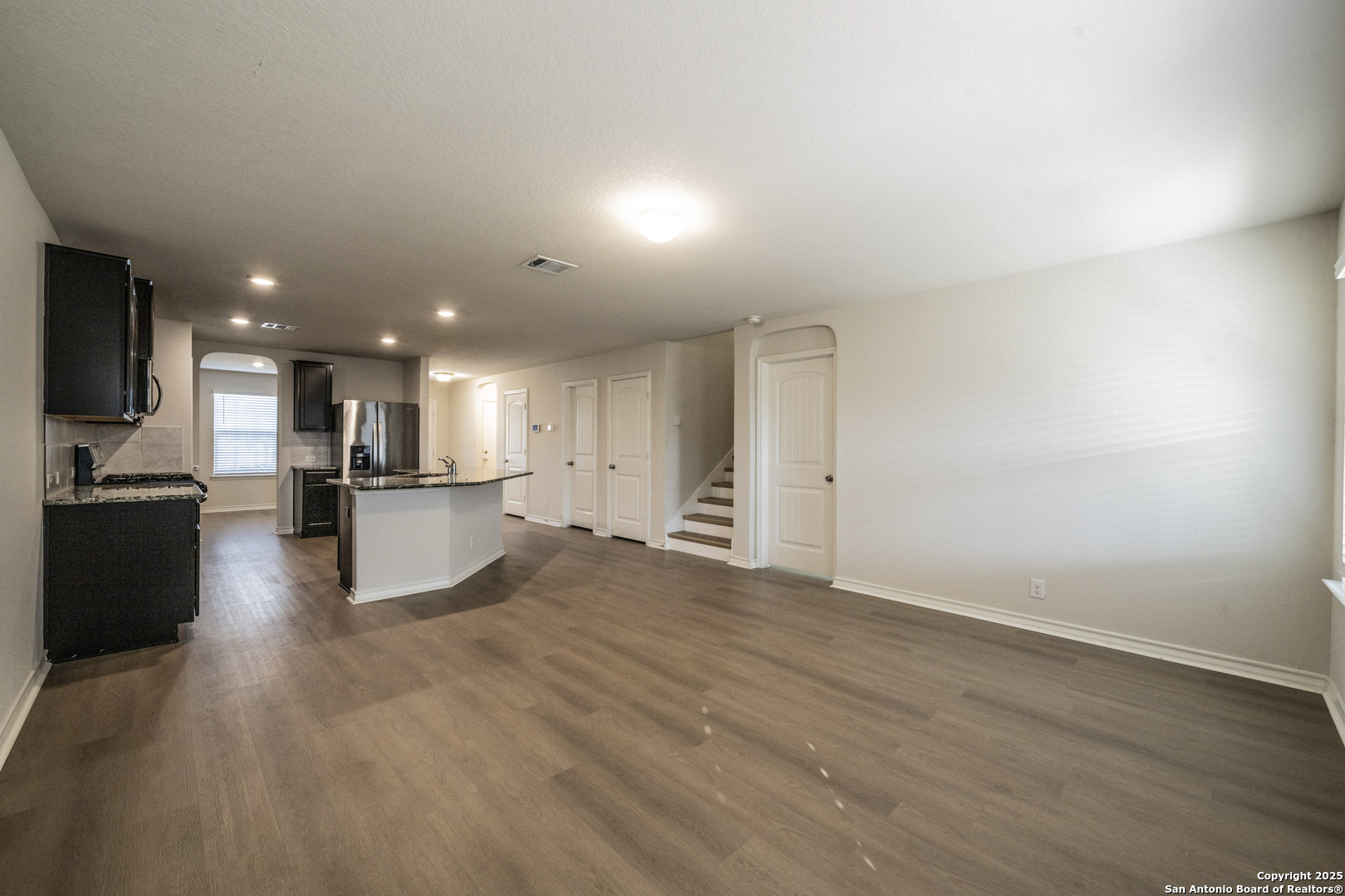 5914 Lazo Valley San Antonio, TX 78244 - Photo 11 of 40 a view of kitchen with refrigerator stove and wooden floor