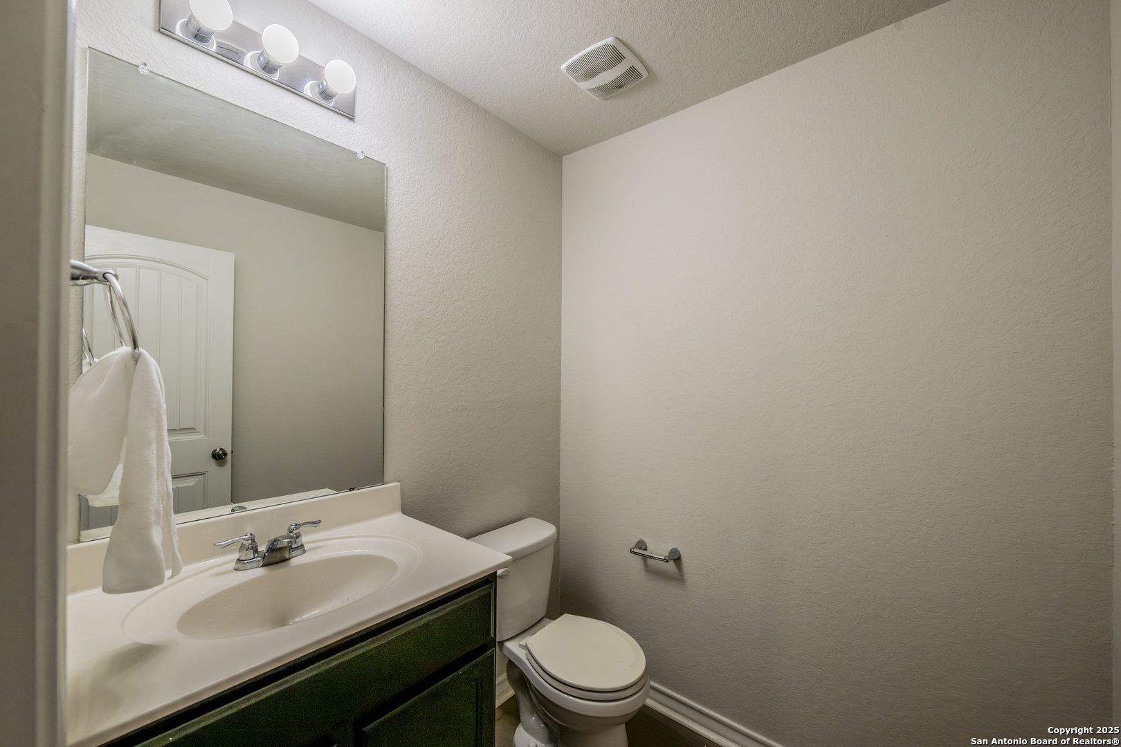 5914 Lazo Valley San Antonio, TX 78244 - Photo 17 of 40 a bathroom with a sink toilet and mirror