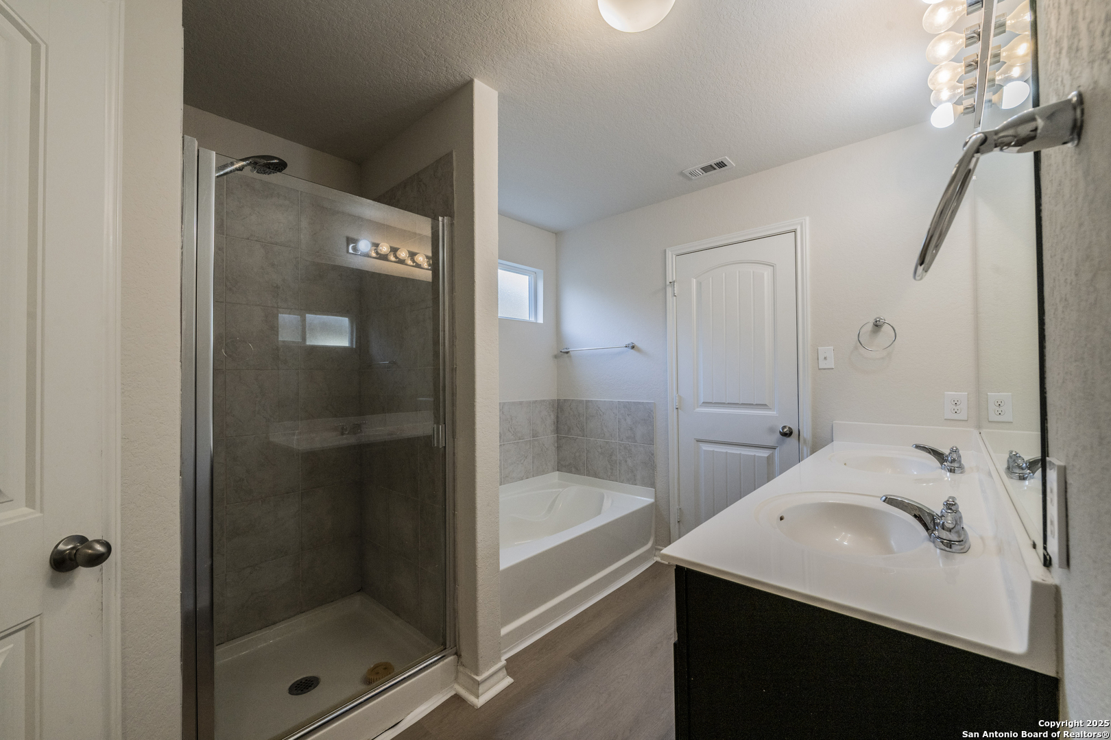 5914 Lazo Valley San Antonio, TX 78244 - Photo 21 of 40 a bathroom with a bathtub and a shower