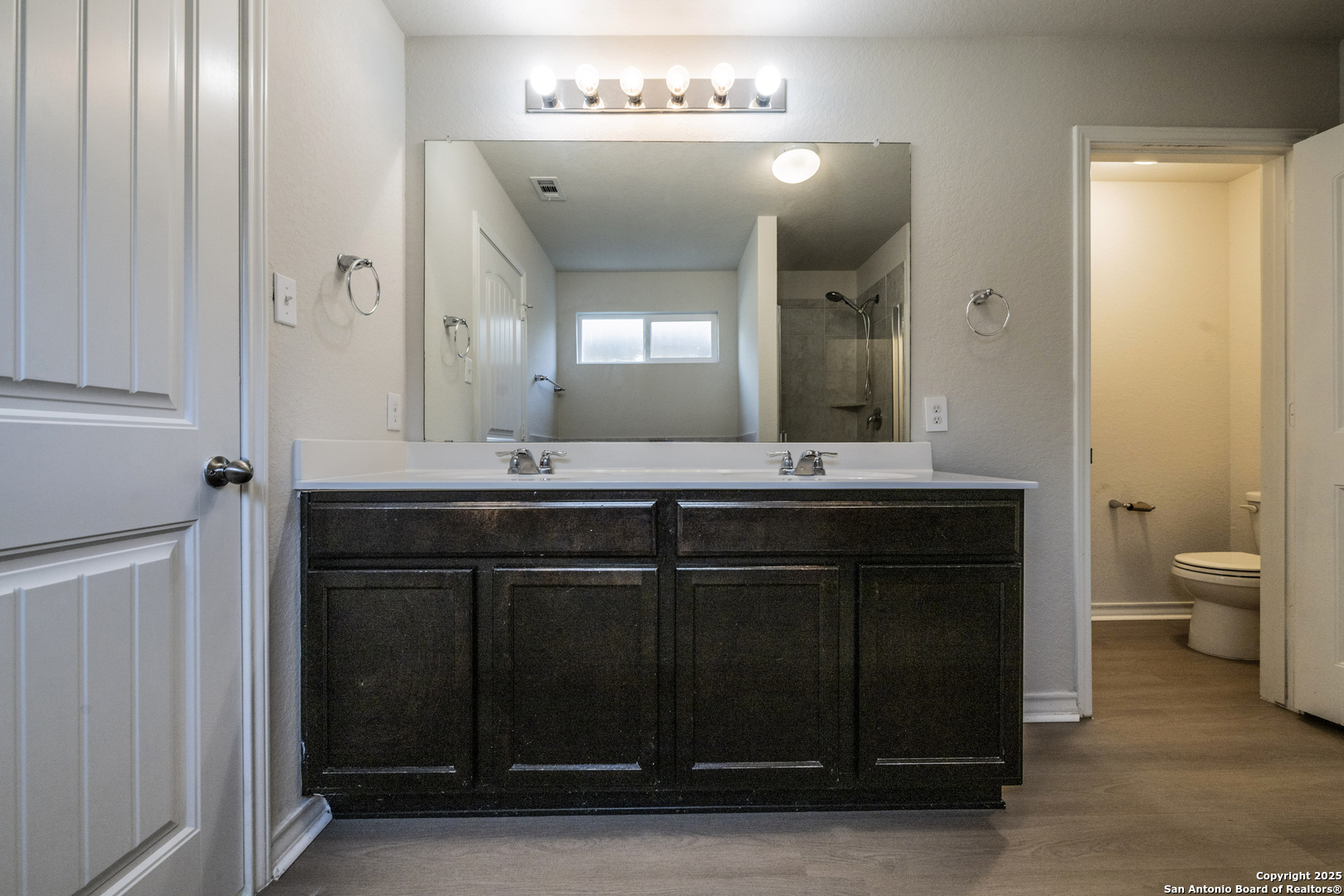 5914 Lazo Valley San Antonio, TX 78244 - Photo 24 of 40 a bathroom with a sink vanity and a mirror