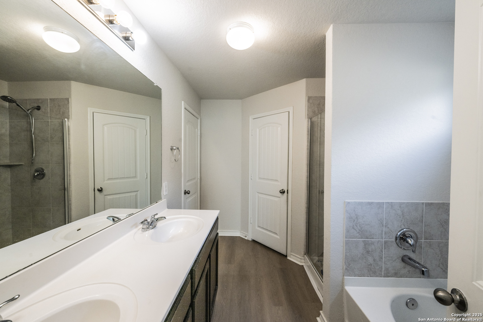 5914 Lazo Valley San Antonio, TX 78244 - Photo 25 of 40 a bathroom with a tub sink and mirror
